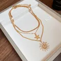 Three-layer gold necklace set featuring starfish and sun charms on a snake chain - Gold Starfish Sun Layered Multi-Layer Necklace