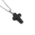 Macro view of minimalist matte black stone cross pendant with silver stainless steel chain - Obsidian Cross