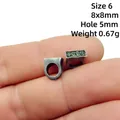 Macro shot of 8x8mm antique alloy bead with Ping An Xi Le engraving and 5mm hole - Size 6