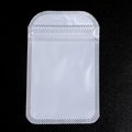 Close-up of translucent plastic packaging bag with white grid edges and hanging hook - Pearlescent