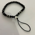 Beaded phone charm with black faceted crystals, silver rings, and rhinestone accent bead - Black Faceted Beads Rhinestone