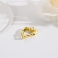 Macro view of a 18k gold plated hollow heart charm with vintage textured surface - ZYN-DMK740G (Gold Lava Heart)