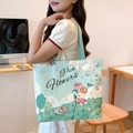 Mint green canvas tote bag featuring cute bear illustrations and Pick Flowers print - Floral Piggy