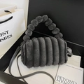 Dark grey faux fur crossbody bag with round top handle and plush striped texture - Gray
