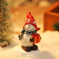 Miniature snowman figurine with red hat and orange gift box for Christmas decor - Snowman with Gift