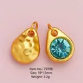 DIY gold-tone teardrop charms with hammered texture and light blue crystal inlay - Gold Teardrop Blue Rhinestone Pendant