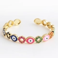 Golden open bangle featuring colorful enamel evil eye charms and micro-set cubic zirconia - Oval Multi-color