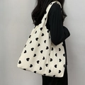 Minimalist heart print canvas tote bag shown on model with large capacity design - Vest Bag / Black Heart