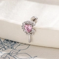 Silver earring with a pink heart zircon and white stones in a magic wand design - Pink