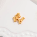 Detailed view of five golden S925 silver cylinder beads with irregular hammered texture - Rhombus Pattern (SZ64) / Large 2.5*6mm (Pack of 5) / Gold