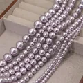 Macro shot of assorted lavender faux pearls in various sizes on a gray jewelry tray - Lavender Purple (no. 14) / Approximately 200 Pieces Per Strip 4mm In Size.