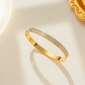 Elegant gold-plated stainless steel bangle featuring three rows of sparkling white zircons - Gold