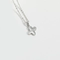 Minimalist silver clover pendant necklace with circular texture on a white background - Letter X / Silver