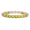 Macro detail of natural amethyst and aventurine stone beads with golden spacers - Rose Quartz + Peridot Style