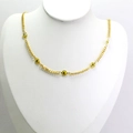 Detail view of a gold-plated choker with yellow Evil Eye beads on a white neck model - Yellow