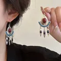Detailed view of bohemian fan-shaped earrings with red agate and blue turquoise stones - 43# Ear Hook - Silver - Red - Blue