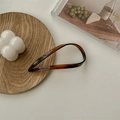 Tortoiseshell acetate U-shaped hair pin for buns shown on a rustic wooden tray - Caramel Coffee/Tortoiseshell