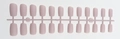 Macro view of 24 pieces nude matte square long press-on nails on a plastic runner - Matte Nude Pink