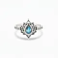 Vintage silver lotus ring featuring a pear-cut blue gemstone and intricate pave diamond accents - US 6 / Blue
