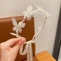 White lace children headband with pearls, rhinestones, and elegant long ribbon ties - Fluttering Butterflies