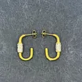 Close-up of U-shaped 18k gold earrings with inlaid pearls and sparkling crystals - U-Shape Half Stone
