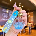 Creative blue cat paw liquid quicksand keychain with star glitter and a soft wrist strap - Blue Luminous Bubble Bead Cat Paw