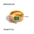 Detailed view of a gold-plated ribbed ring featuring a rectangular green gemstone inlay - Gold/Green Rectangle Stone