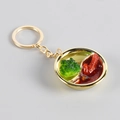 Golden keychain with a miniature hot pot model featuring realistic yin-yang broth design - Chicken Wings Hot Pot / Gold Key Ring Style