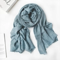 Blue linen scarf with white vertical stripes and natural frayed edges on a minimalist desk - 1477 Modal Denim Blue