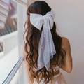 Elegant white mesh bow hair clip with pearl accents worn on model's hair - White Single Layer Slanted