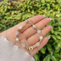 Detail of handmade 18k gold plated bracelet with pearls, pink beads and coin charm - Light Pink