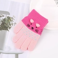 Close-up of cute knit cat face embroidery and blue polka dots on pink winter gloves - Kids 3-7 Years / Light Pink