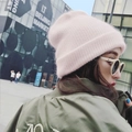 Chic pink knit beanie hat for women paired with sunglasses and a green flight jacket - Light Pink