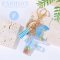 Letter F ocean style keychain with blue resin, starfish, shell and leather tassel - Letter F
