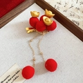 Detail of New Chinese style hair clip featuring red pom-poms and golden ingot tassels - Gold Ingot Style - Red Pom Pom Tassel