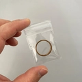 Golden stainless steel ring with Roman numerals in clear PVC jewelry storage bag - 30 Micron 4x6cm Resealable / 100 Pcs/Pack