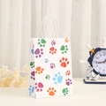 Vertical paper party gift bag with colorful paw prints and white twisted handles - H21*L15*W8 / Colorful