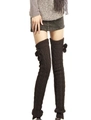 Close-up of cable knit leg warmers in dark coffee with side pom-poms and ribbed texture - One Size / Coffee