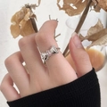 S925 sterling silver bow ring featuring a pink zircon stone on a model's finger - J2723 Silver Pink Rectangle Bow Ring