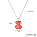 Gold stainless steel necklace with red resin bear pendant and dimensions annotation - Big Red Cross Chain