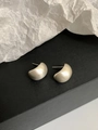 Close-up of minimalist gold matte geometric earrings on a black surface - Matte Textured Curved Style (69#)