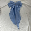 Elegant oversized light blue satin bow hair clip with long flowing ribbon streamers - Blue