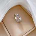 Detail of silver titanium ring featuring Roman numeral cut-outs and small crystals - US 8 / Silver