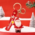 Portachiavi Babbo Natale con cinturino rosso e ciondolo stella su fondo neve - Che tiene la stella