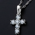 Macro view of a silver cross pendant featuring six round-cut moissanite stones in claw setting - Cross-White