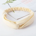 Beige cross knot headband in elastic ribbed knit fabric for yoga and daily wear - Knitted Beige