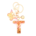 Resin letter T keychain with pink butterfly and orange glitter in golden finish - Letter T