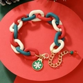 Detailed view of Christmas bracelet with red and green resin links and snowflake charm - D1053 (Chunky Chain Snowflake)