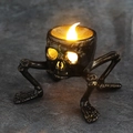 Gothic skull LED candle light with bronze finish for Halloween skeleton decor - Four-Legged Skeleton Candle
