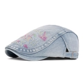 Light blue washed denim flat cap with colorful graffiti embroidery and metal buckle - Light Blue